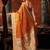 Orange premium tissue silk blend saree with tassels & blouse piece
