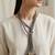 Gold plated multi strand purple cords necklace