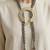 Gold plated multi strand sage green orbit cords necklace