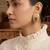 Gold plated ruby red stone teardrop earrings