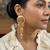 Gold plated matsya statement dangler earrings