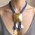 Gold plated blue rope pyramid bolo necklace
