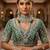 Green 2-layer bridal jewelry set with earrings, maang tikka, pasha, nath & panja | rhodium plated
