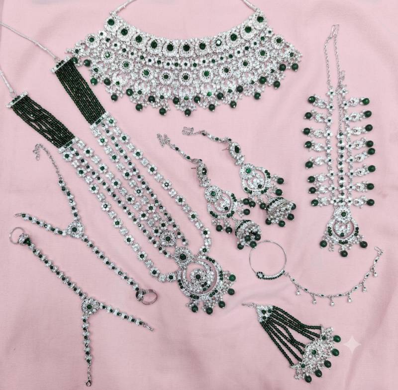 Green 2-layer bridal jewelry set with earrings, maang tikka, pasha, nath & panja | rhodium plated