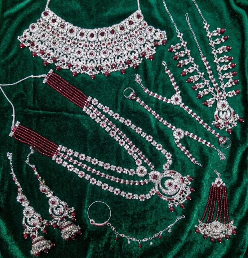 Maroon 2-layer bridal jewelry set with earrings, maang tikka, pasha, nath & panja | rhodium plated
