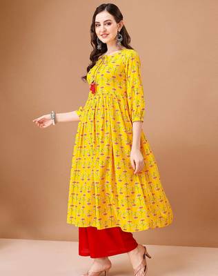 Yellow rayon fit &flared floral printed casual kurta for women 4