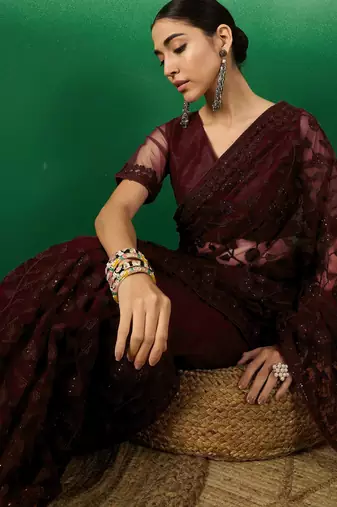 Burgundy embroidered work net saree with floral design