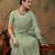 Light olive embroidered work net saree with floral design