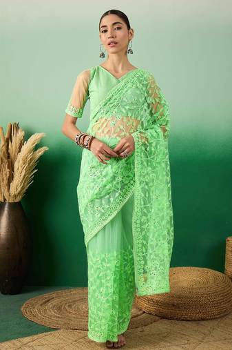 Pastel green work net saree with floral design