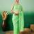 Pastel green work net saree with floral design