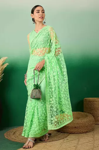 Pastel green work net saree with floral design
