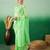 Pastel green work net saree with floral design