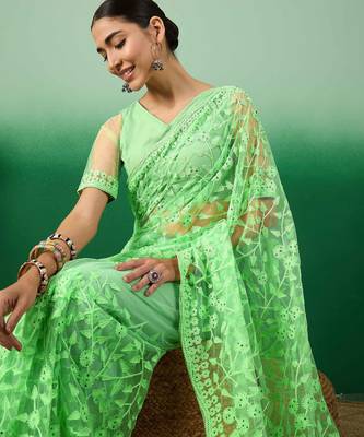 Pastel green work net saree with floral design 4