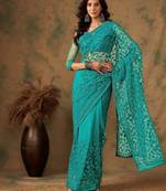 Teal blue work net saree with floral design