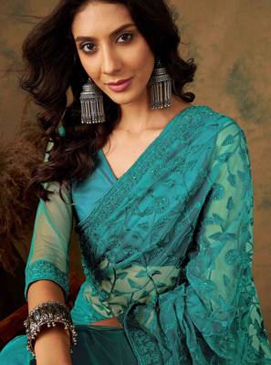 Teal blue work net saree with floral design 5