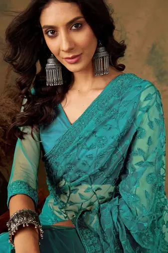 Teal blue work net saree with floral design