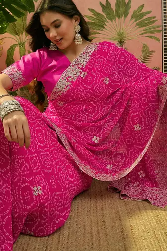 Pink bandhani printed saree with embroidered border