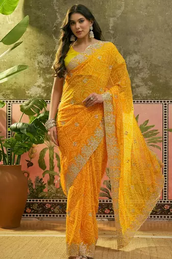 Yellow bandhani printed saree with embroidered border