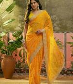 Yellow bandhani printed saree with embroidered border