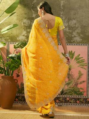 Yellow bandhani printed saree with embroidered border 5