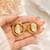 Baroque pearl stud earrings with gold wire wrap design