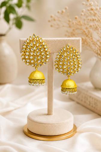 Gold-toned kundan jhumka earrings with pearl drops