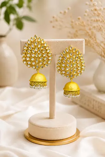 Gold-toned kundan jhumka earrings with pearl drops
