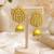 Gold-toned kundan jhumka earrings with pearl drops