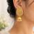Gold-toned kundan jhumka earrings with pearl drops