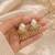 Baroque pearl sunburst stud earrings in gold-tone