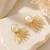 Baroque pearl sunburst stud earrings in gold-tone
