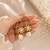 Gold-tone daisy flower baroque pearl drop earrings for women