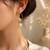 Gold-tone daisy flower baroque pearl drop earrings for women