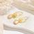 Gold-tone daisy flower baroque pearl drop earrings for women