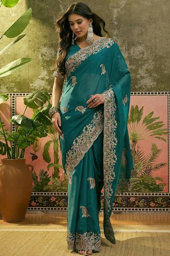 teal blue embroidered saree with paisley motifs
