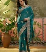 teal blue embroidered saree with paisley motifs