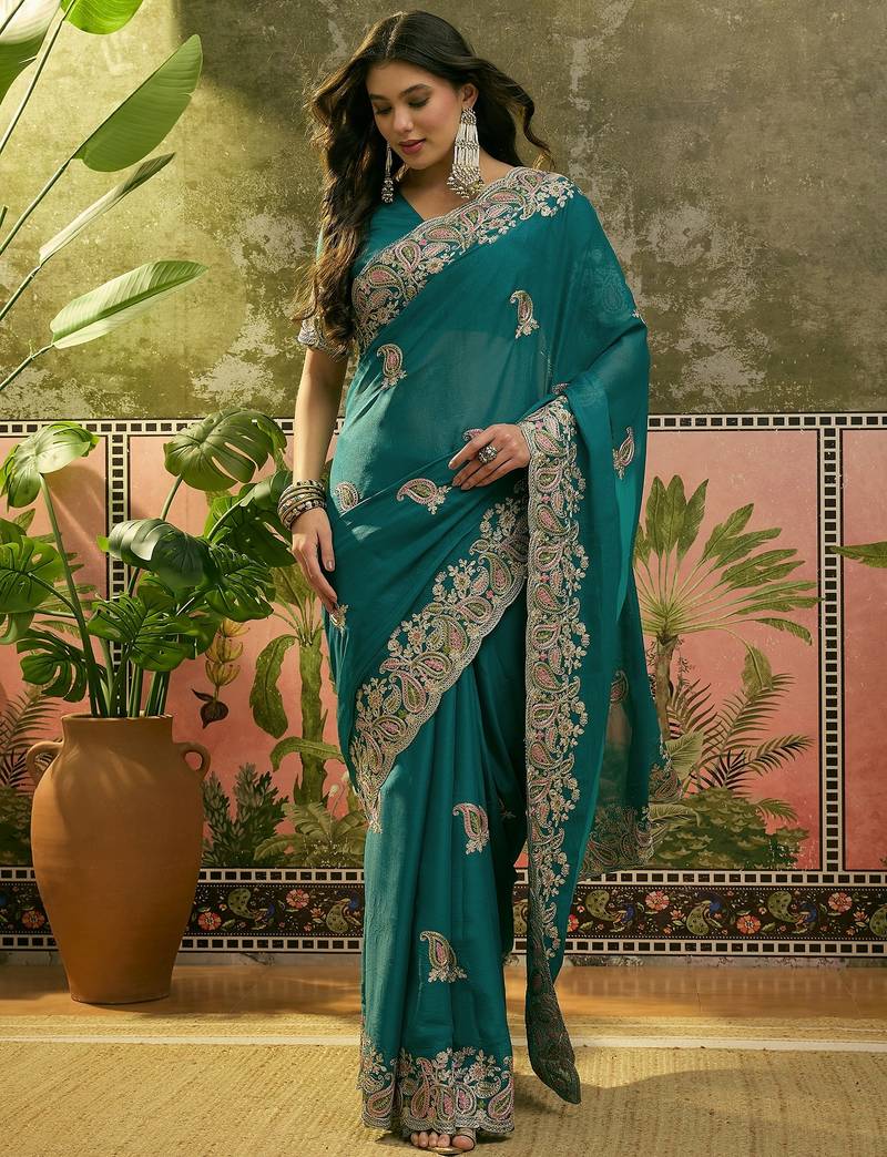 teal blue embroidered saree with paisley motifs