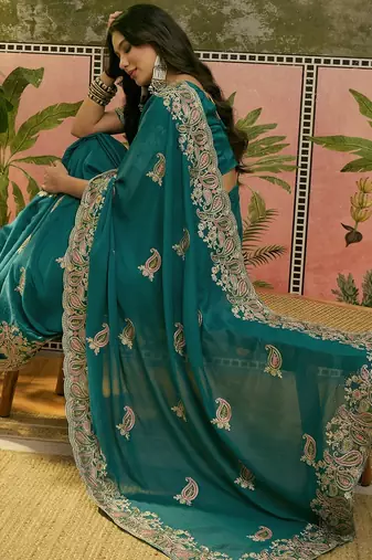 teal blue embroidered saree with paisley motifs