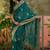 teal blue embroidered saree with paisley motifs