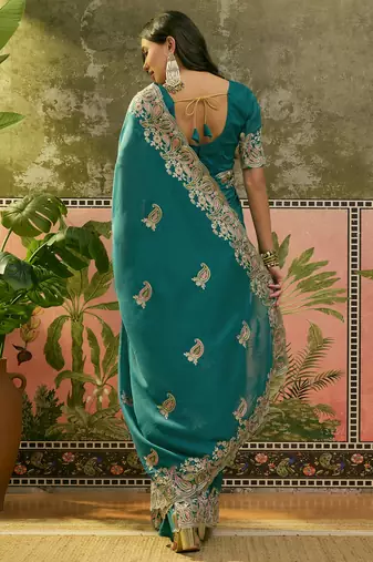 teal blue embroidered saree with paisley motifs