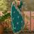 teal blue embroidered saree with paisley motifs