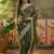 olive green embroidered saree with paisley motifs