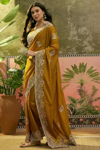 mustard embroidered saree with paisley motifs