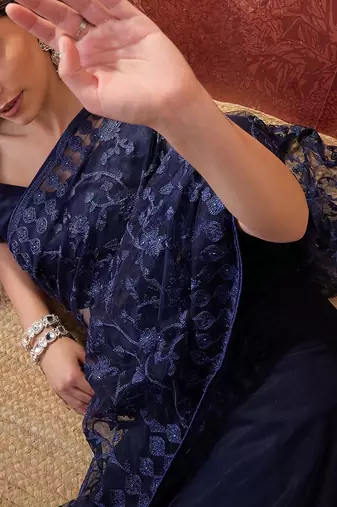 Navy blue embroidered sheer saree with floral motifs