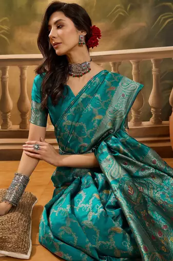 teal banarasi jacquard saree with rich zari weaving, mina & lace work on pallu