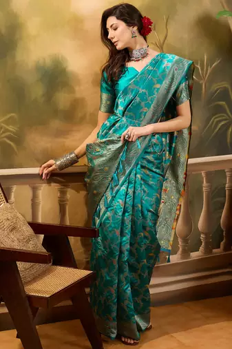 teal banarasi jacquard saree with rich zari weaving, mina & lace work on pallu
