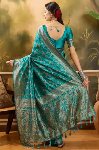 teal banarasi jacquard saree with rich zari weaving, mina & lace work on pallu