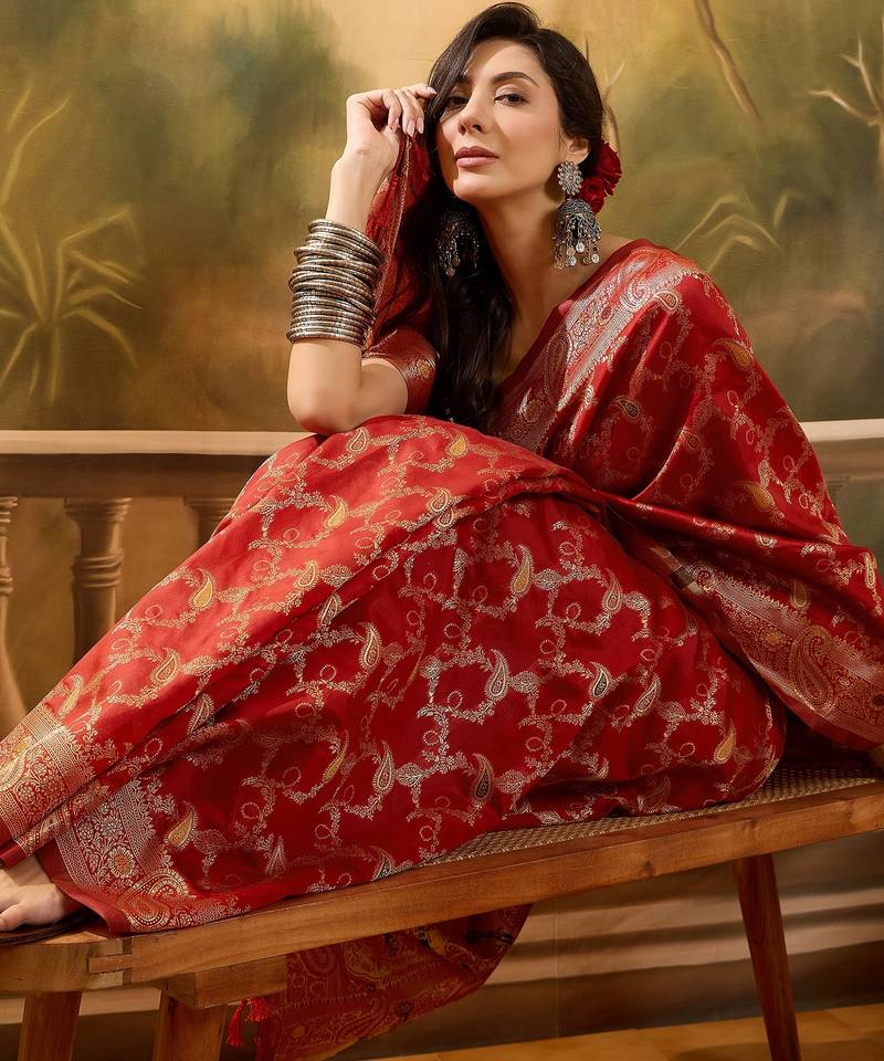 red banarasi jacquard saree with intricate zari weaving, mina & lace work on pallu