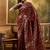 maroon banarasi jacquard saree with rich zari weaving, mina & lace work on pallu