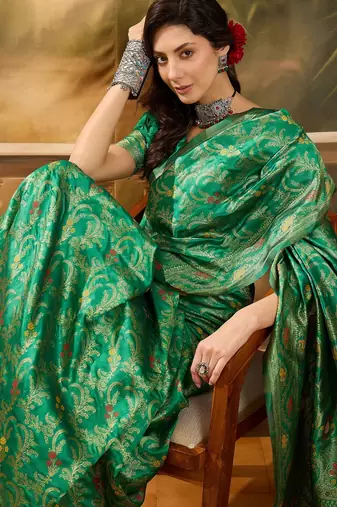 green banarasi jacquard saree with elegant zari weaving & tassel pallu     includes unstitched blouse